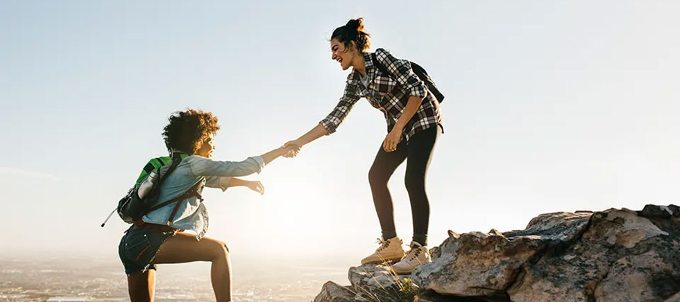 girls-climbing-a-mountain