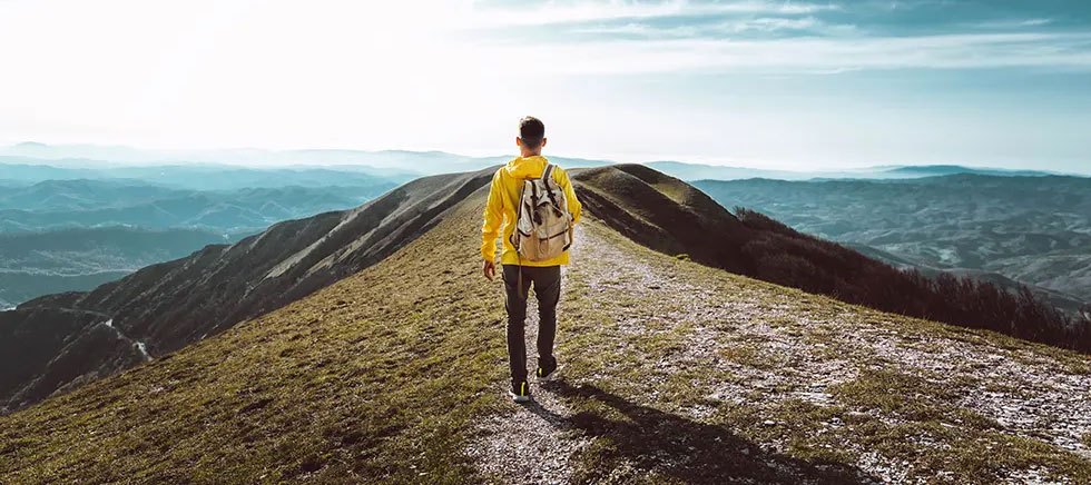 man-on-top-of-a-mountain